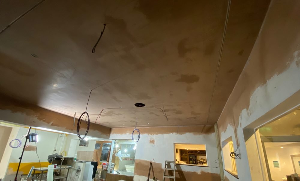 Commercial ceiling plastering in progress in Rugby